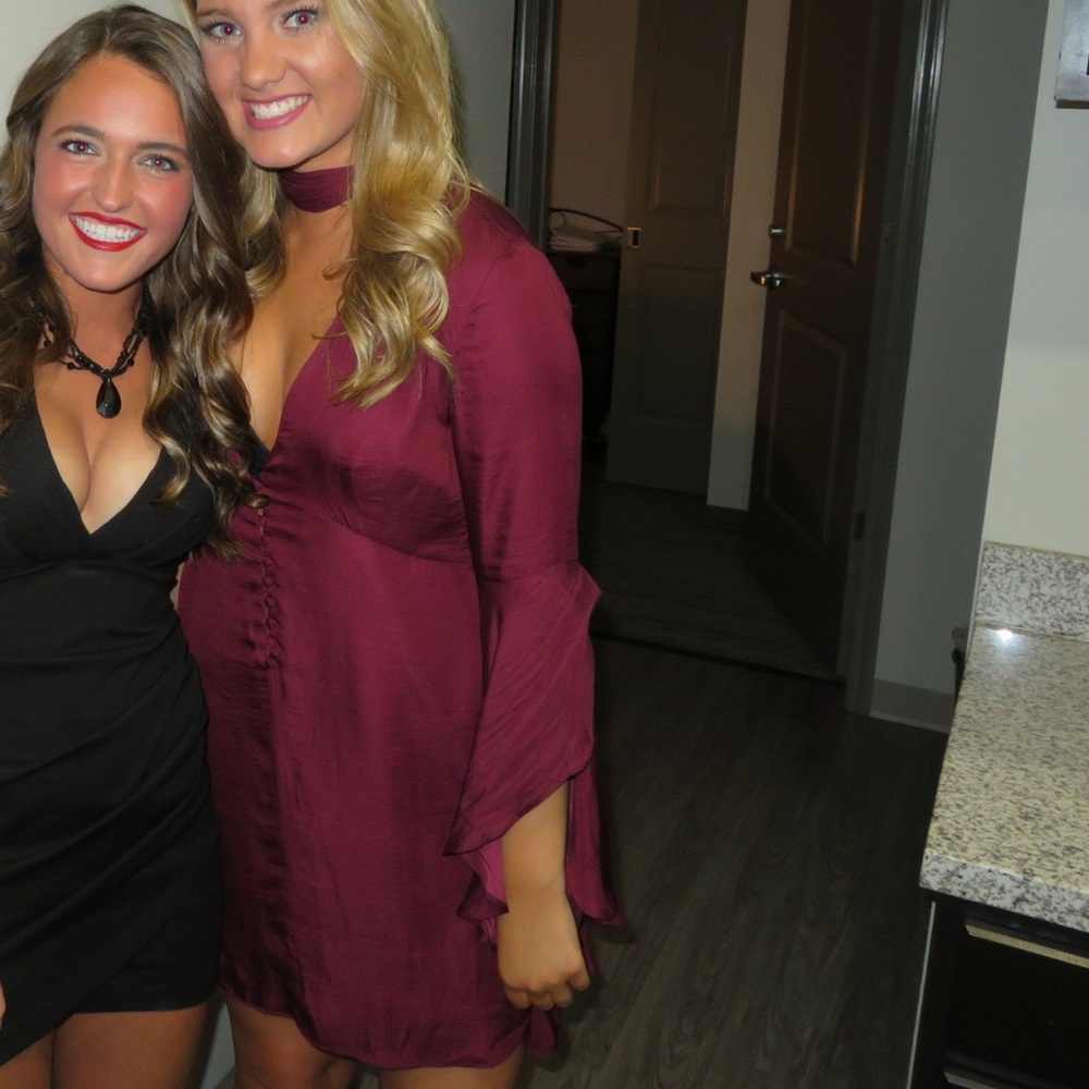 Red bell sleeve plunging v-neck dress